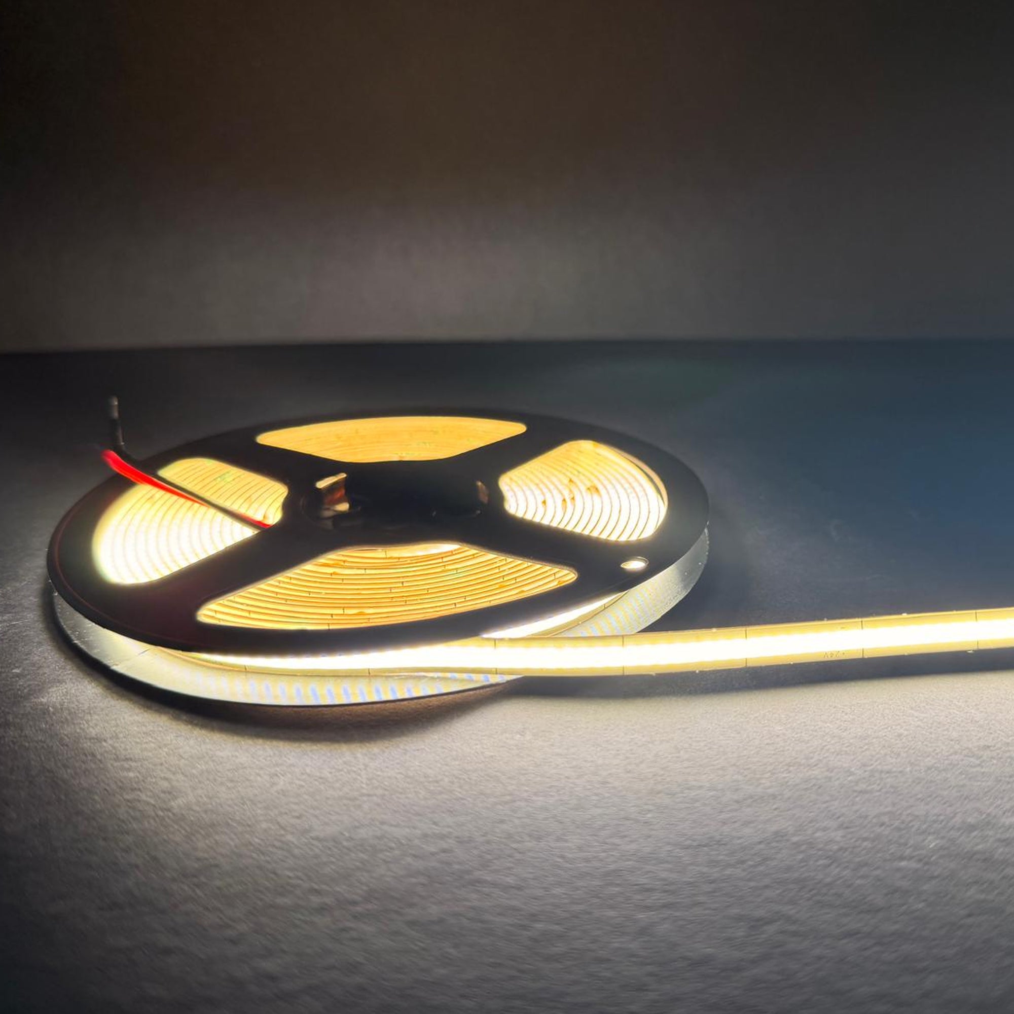 UL listed COB LED strip light 24V 6.5mm showing flexible LED strip reel with uniform indoor illumination