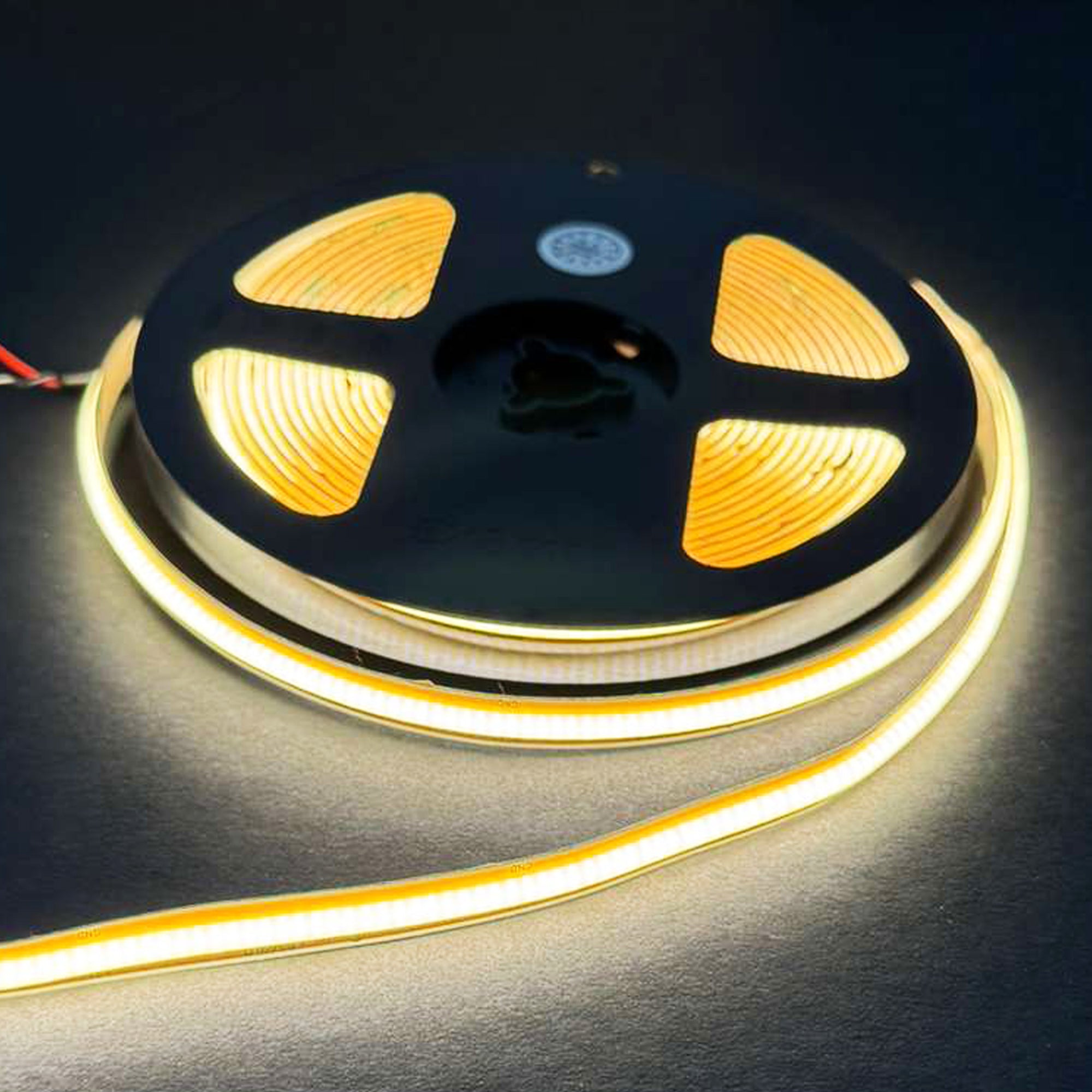 UL listed free cut COB LED strip light 24V 8mm indoor showing illuminated dotless linear lighting on reel